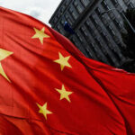 VPN Use Now a Liability in China Close-up of the Chinese flag waving in the wind