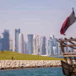 Trump’s $1.2T Qatar Deal—Real or Hype? Doha skyline with Qatar flag and dhow boat