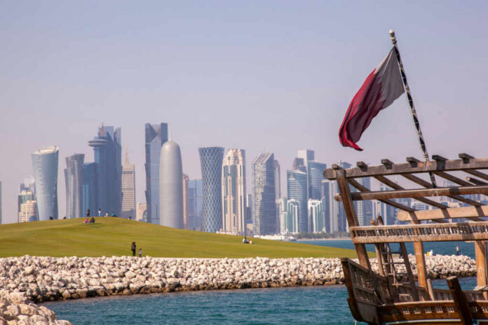 skyline-of-doha2152470759jpg Doha skyline with Qatar flag and dhow boat