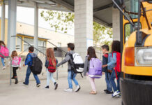 Federal Crackdown Targets Classroom ‘Ideology’ Group of children walking towards a school bus
