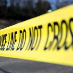Gas Station Sting Spirals Into Tragedy Yellow police tape stretched across an outdoor scene
