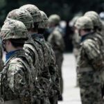 Soldiers in camouflage uniforms standing in formation