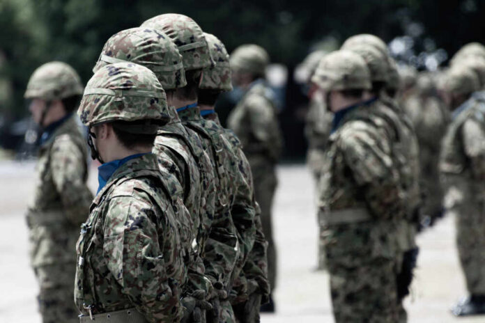 Soldiers in camouflage uniforms standing in formation