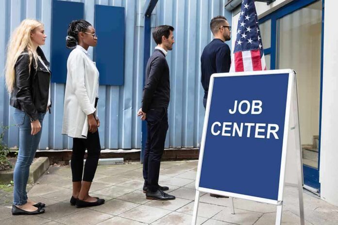 shutterstock_1522522562 People standing in line outside a job center entrance