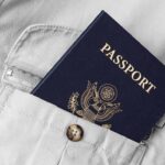 Birth Tourism Crackdown Escalates Passport in shirt pocket