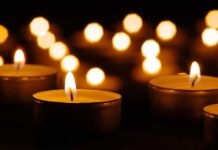 Bronx Bodega Horror: Cop’s Son Down Tea light candles with warm glowing flames