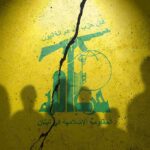 Hezbollah Pushback Begins — Or Backfire? Hezbollah flag graphic with crack and silhouetted figures