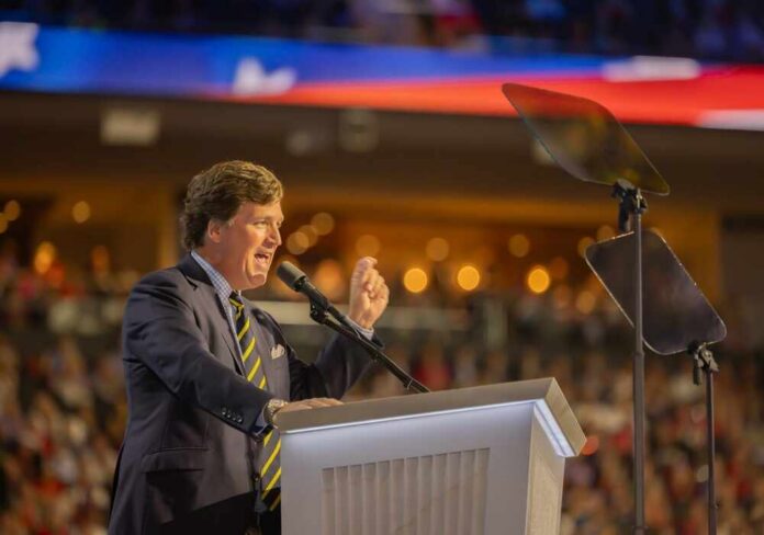 Milwaukee,,Wis.,,July,18,,2024:,Tucker,Carlson,Addresses,The A speaker passionately addressing an audience from a podium
