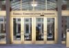 Federal Communications Commission building entrance with gold doors