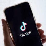 Smartphone displaying TikTok app logo on screen