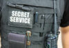 Tactical vest with equipment and a visible service patch