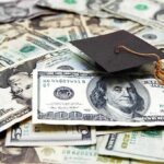 DOJ Slams States Over ‘Illegals’ Tuition Breaks Graduation cap on a pile of US dollar bills