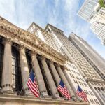 Peace Hype Ignites Wall Street New York Stock Exchange facade with columns and American flags