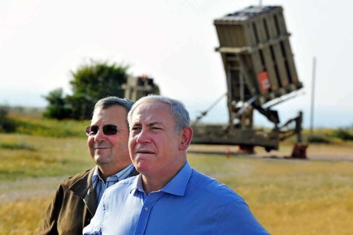 shutterstock_145246012 two men standing near a missile defense launcher outdoors