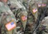 Veterans Dive In—PTSD Eased Under Ocean Giants U.S. flag patches on camouflage military uniforms