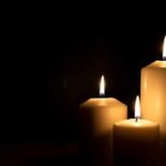 U.S. Outrage Brewing Over West Bank Death Three lit candles against a dark background
