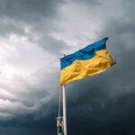 Ukrainian flag waving against a stormy sky