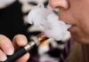 Doctors Warn: Vaping Supercharges Ozempic Misery Close-up of a person vaping, exhaling smoke clouds