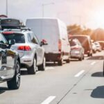 Camera Grid Survives — Freedom Takes A Hit Traffic jam with cars and vans on a multi-lane highway