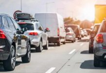 Camera Grid Survives — Freedom Takes A Hit Traffic jam with cars and vans on a multi-lane highway