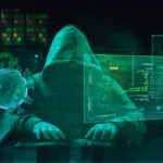 Billion-Dollar Scam Empires Crushed Hooded hacker at computer with digital virus graphics
