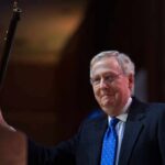 Proof Or Propaganda? CNN Meltdown Over McConnell Call A man in a suit holding a gavel at a podium