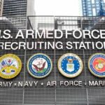 Trump-Era Push Supercharges Enlistments U.S. Armed Forces recruiting station facade with service emblems