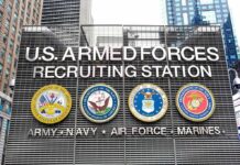 Trump-Era Push Supercharges Enlistments U.S. Armed Forces recruiting station facade with service emblems