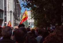 Missing Table Sparks Morocco Payout Uproar Crowd with Spanish flags in a city street