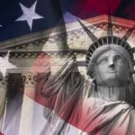 Thomas Torches Big Law Hypocrisy Statue of Liberty overlaid with U.S. flag and classical courthouse