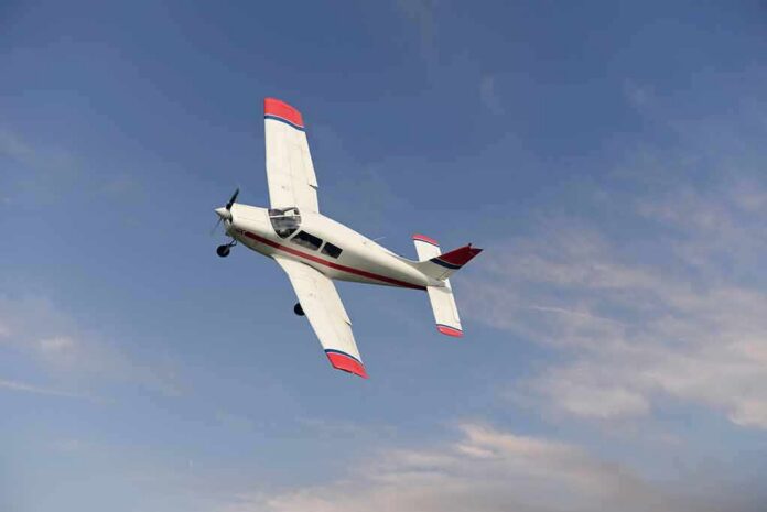 shutterstock_787587400 Single-engine airplane banking in a clear sky