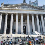 HSI Child-Protector Indicted — Community Stunned Reporters and photographers gathered outside a neoclassical courthouse