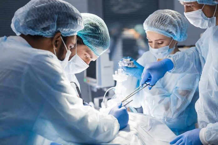 shutterstock_1265400856 surgeons performing an operation