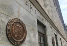 Trump Dividend Twist: Checks Without Borrowing? U.S. Treasury building exterior with bronze seal on stone wall