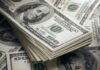 Flagged Network Money Triggers Ethics Brawl Stack of US 100 dollar bills