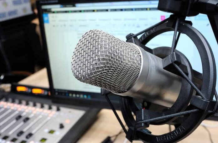 shutterstock_1298231359 Close-up of a studio microphone in a shock mount