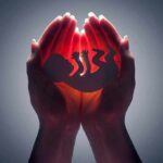 Andorra’s Abortion Gambit Tests Rome Hands cupping a glowing fetal silhouette