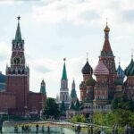 Saint Basil's Cathedral and Kremlin towers under a cloudy sky