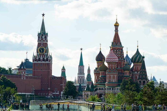 shutterstock_1441775855 Saint Basil's Cathedral and Kremlin towers under a cloudy sky