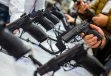 Judges Gut Costly Handgun Middleman Scheme Handguns on display at a store counter
