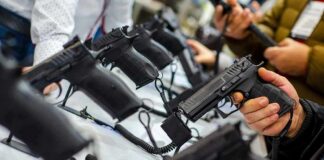 Handguns on display at a store counter