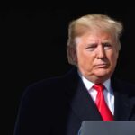 Birthright Showdown: Trump Pushes Again Donald Trump at a podium with a microphone