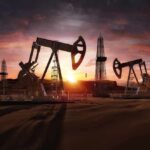 Oil Shock: Saudi Lifeline Suddenly Halted Oil pumpjacks and derricks at sunset in a desert field