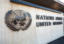 United Nations emblem and signage on a concrete wall