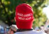 MAGA Muzzle? Bartiromo Out After Leak person wearing a red baseball cap at an outdoor gathering