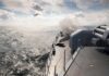 naval warship firing deck gun at sea