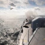 Navy Workhorse Returns—Cue Hill Meltdown naval warship firing deck gun at sea