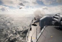 Navy Workhorse Returns—Cue Hill Meltdown naval warship firing deck gun at sea