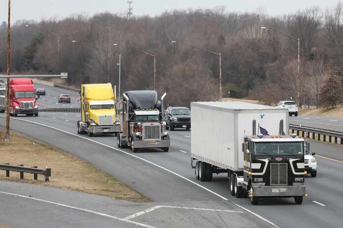 Convoy of semi trucks driving on a multi-lane highway