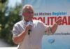 Power Broker Move: Kirk Unites RFK And Trump Man speaking on an outdoor stage with a microphone